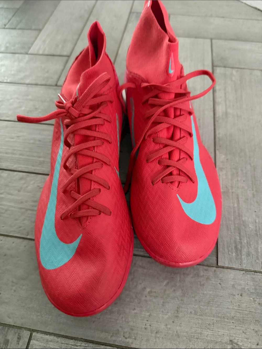 Nike Red Soccer turf Cleats with Teal Swoosh Accents